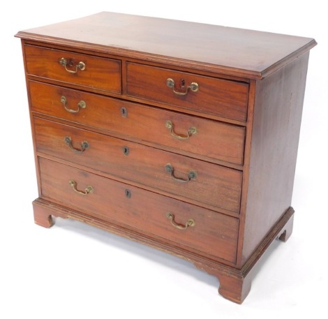 A George III mahogany chest, of two short over three long graduated drawers, raised on bracket feet, 81cm high, 95cm wide, 50cm deep.