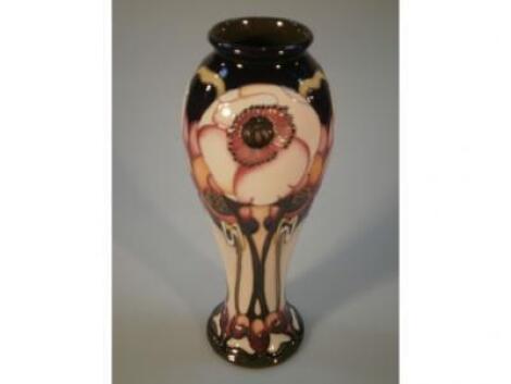 A Moorcroft slender baluster vase with 'Emma' pattern decoration