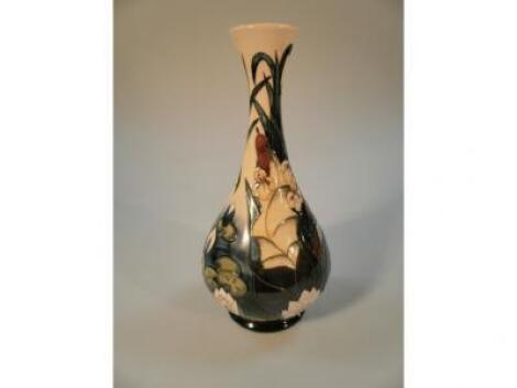 A Moorcroft bottle vase with a 'Lamia' decoration