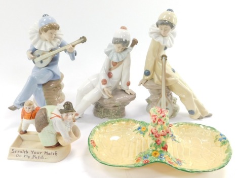 Three Nao porcelain figures of mandolin players, comical figural match striker ashtray "Scratch Your Match On My Patch..." and a Crown Devon two division sweetmeat dish. (5)