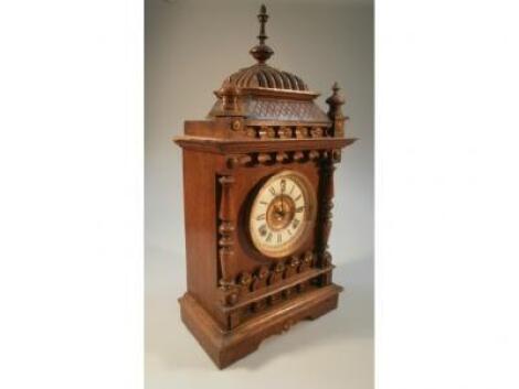 A Victorian oak cased mantel clock
