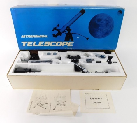 An Astronomical telescope with tripod, boxed.