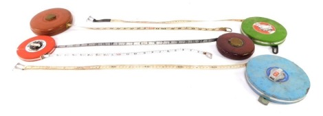 A group of measuring tapes, to include Rabone and Chesterman.