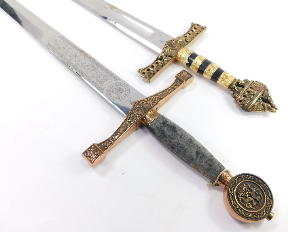 Two replica swords, one stamped King Arthur Excalibur, each with a gilt ...