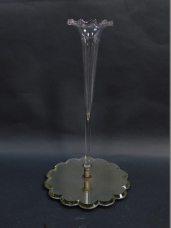 An early 20thC clear glass single trumpet epergne, raised on a shaped mirrored base, 49.5cm high.