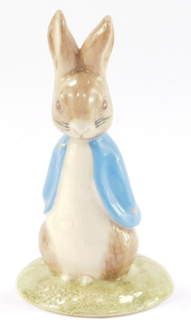 A Beswick Beatrix Potter figure modeled as Sweet Peter Rabbit, limited gold edition 1662/2950, boxed, with stand and certificate.