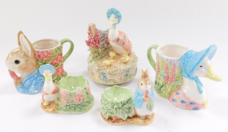 A Frederick Warne & Company Beatrix Potter Carousel, of Jemima Puddleduck and Her Ducklings, playing the tune 'Oh What A Beautiful Morning', together with Jemima Puddleduck and Peter Rabbit egg cups and mugs, The Peter Rabbit Library and further Beatrix P