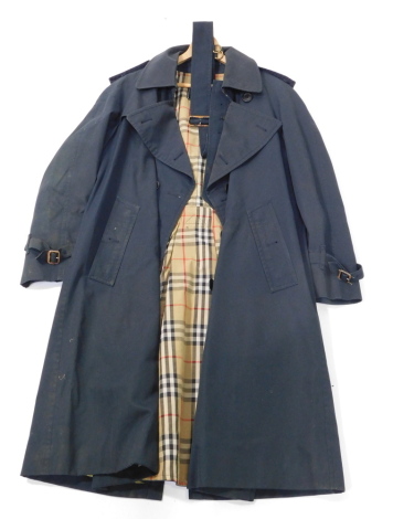 A Burberry gentleman's navy blue rain mac, polyester cotton cloth and lining.