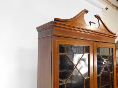 An Edwardian mahogany and satinwood banded bureau bookcase, the break arch pediment over a pair of glazed doors enclosing three shelves, above a fall flap with paterae inlay opening to reveal two drawers and eight recesses, over four long graduated drawer - 3