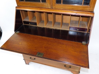 An Edwardian mahogany and satinwood banded bureau bookcase, the break arch pediment over a pair of glazed doors enclosing three shelves, above a fall flap with paterae inlay opening to reveal two drawers and eight recesses, over four long graduated drawer - 4