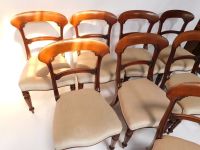 A set of eight Victorian mahogany dining chairs, each with a shaped leaf carved bar back, a padded serpentine fronted seat, on turned and fluted legs. - 2