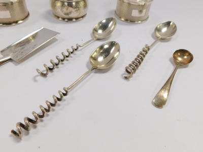 A pair of silver napkin rings, with engine turned decoration, Birmingham 1957, further napkin ring, monogram engraved, Birmingham 1901 (AF), three coffee spoons with coiled handles, salt spoon, Sheffield 1933, 2.54oz, and a Victorian silver plated trowel - 3