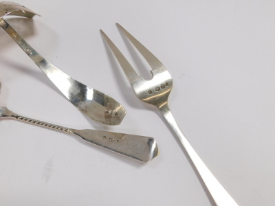 A Dutch silver early 20thC cake slice, assayed for Schoonhoven, serving fork, assayed for The Hague, and a sugar sifting spoon, 4.67oz.  - 2