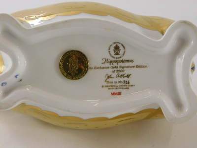 A Royal Crown Derby porcelain paperweight of a hippopotamus, exclusive gold edition number 916 of 2500, with gold coloured stopper. - 7