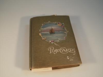 A picture postcard album containing assorted topographical GB and greeting cards