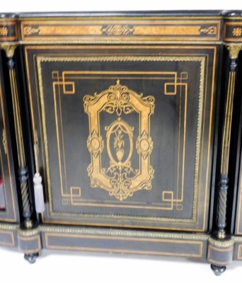 A Victorian ebonised credenza, with gilt metal mounts, the panelled door inlaid in burr walnut with an urn surmounted by a rectangular cartouche flanked by two turned pillars and bowed glazed doors, enclosing a velvet lined interior, on bun feet, 114cm hi - 2