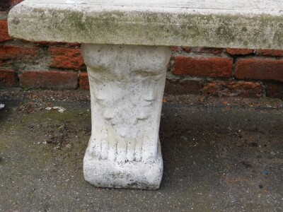 A reconstituted stone garden bench, the rectangular top on two plinths, 41cm high, 140cm wide, 37cm deep. - 2