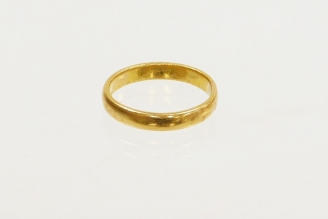 A 22ct gold thick wedding band, ring size R, 5g.