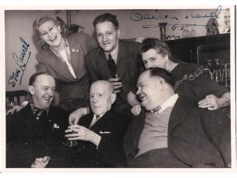 An autograph photograph; signed by Stan Laurel and Oliver Hardy