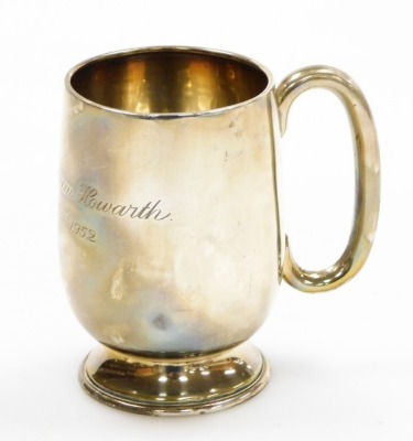 A silver child's tankard, with engraving Timothy William Howarth April 3rd 1952, Birmingham 1946, 3oz, 9cm high.