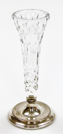 An early 20thC cut glass stem vase, on a silver stepped base, with beaded detailing, Birmingham 1985, with a weighted base, 21cm high.