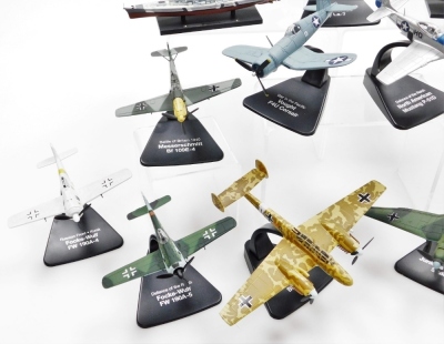 A group of diecast model aircrafts, to include mainly examples on stands, to include Burma Bridge Busters, Russia Front Kursk, Nazi German 1944 Junkers Jew, War In The Pacific, Vought F4U Corsair, Battle of Britain 1940, Messerschmitt Bf 109 E-4, Defence - 4