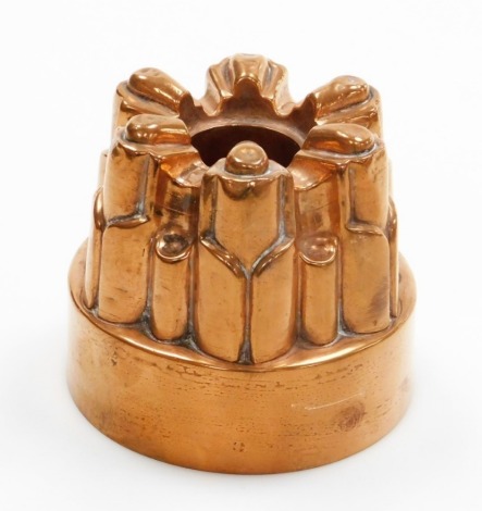 A Victorian Benham and Froud copper jelly mould, with six fluted point design, numbered 458 with cross and orb symbol, 10.5cm high, 11.5cm wide.