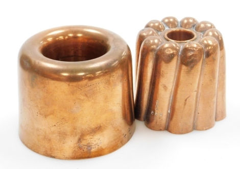 Two Victorian copper jelly moulds, comprising WS Adams & Son circular mould of plain design, 9cm high, 10cm wide, and a Benham and Froud round turreted jelly mould, numbered 558 and with alban cross symbol, 9cm high, 9cm wide. (2)