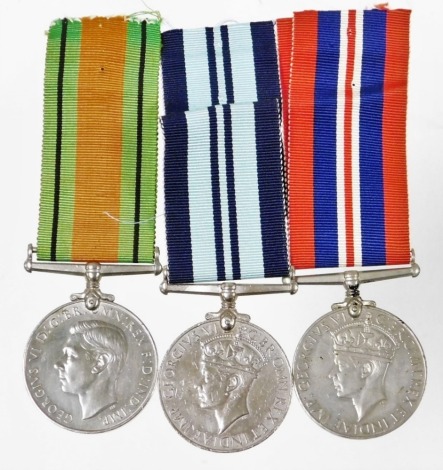 WWII medal trio, comprising War medal (1939-45), India Service Medal, and Defence medal.