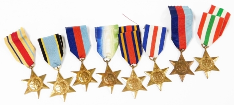 A collection of WWII medal stars, including 1939-45 (2), Atlantic Star, Africa Star, Burma Star, Italy Star, and France and Germany star, and a Air crew Europe star copy. (8)