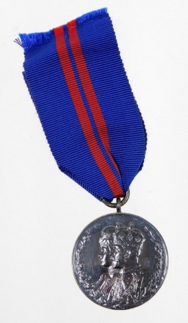 A George V Coronation medal 1911, with ribbon.