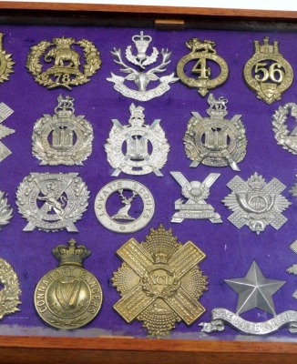 A collection of military cap badges, including some reproductions, Lorats Scouts, Highlanders, Cameroonians Highland Regt, Camerian Highlander, etc., 30, cased. - 3