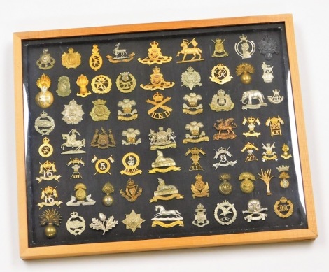 A collection of military cap badges, to include some reproductions, Lancashire Fusilliers, Royal Lincolnshire Regt, Manchester, etc. (66, cased)