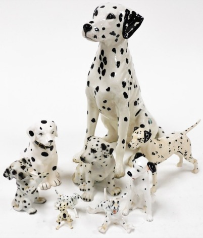 A group of Dalmatian ornaments, to include a large Beswick seated Dalmatian, 36cm high, a Beswick Arnoldene matte Dalmatian, a Disney figures Dalmatian, and various others, unmarked. (9)