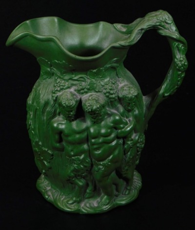 A 19thC Minton type Bacchus and cherub jug, in green glaze, raised with various figures, raised ribbon mark beneath, 17cm high.