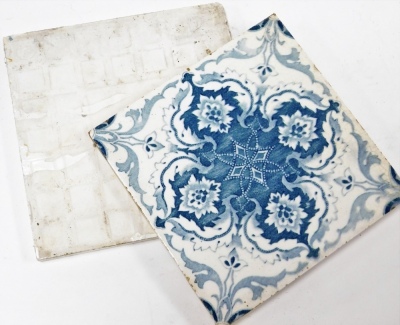 A group of Edwardian wall tiles, to include a set of nine tiles with brown mottled detailing of daisies, 15.5cm x 15.5cm, and seven blue and white floral tiles. (a quantity) - 2