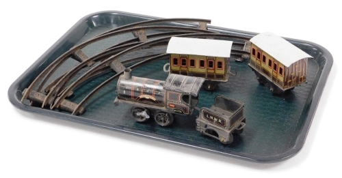 A King Edward VII clockwork tin plate train, and two various carriages and an LNWR Bavarian carriage end and some loose track.