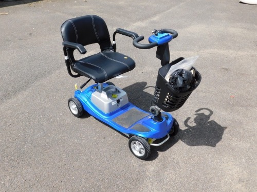 An Illusion mobility scooter, model Komfi Rider Vogue manufacturer 1 Rehab, with instruction guide and device history record from 1 Rehab, with battery charger and two keys, in blue.