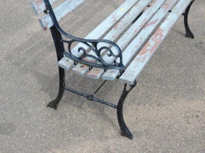 A cast metal garden bench, with blue painted wooden slats and black painted ends, 72cm high, 122cm wide, 42cm deep. - 2