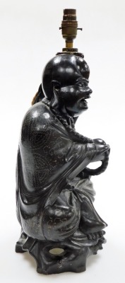 A Chinese teak figure of seated Putai with beads and staff, the body profusely inlaid with silver wire designs, converted to a table lamp, 46cm high. (AF) - 9