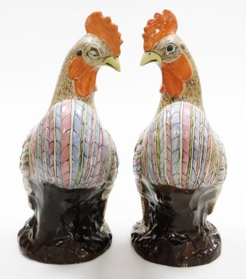 A pair of late 20thC Chinese pottery figure of cockerels, with enamelled decoration, 49cm high. - 4