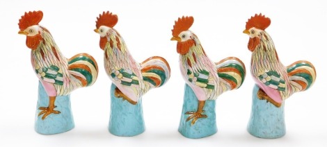 Two pairs of Chinese porcelain figures of cockerels on turquoise bases, enamelled decoration, impressed marks, 29cm high.