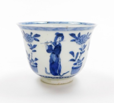 A Japanese porcelain tea bowl, in imitation of a Kangxi original, with everted rim decorated in blue and white depicting female musicians and flowers, signed Zoshuntei Sampo sei to base and collection reference number 14, 19thC, 8cm high. (AF)