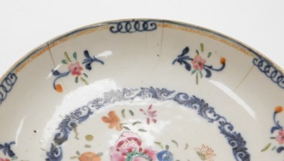 A Chinese porcelain plate, decorated with a central roundel of flowers with a scrolling underglaze blue border, 19thC, 16cm diameter. - 4