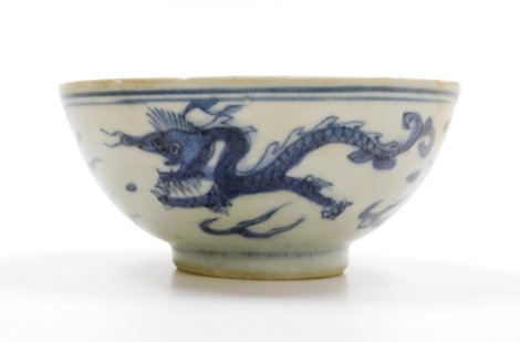 A Chinese blue and white porcelain bowl, the central circular panel with birds over waves and a flaming pearl, the exterior with dragon, phoenix and flaming pearl, probably Ming dynasty, 14.5cm wide.