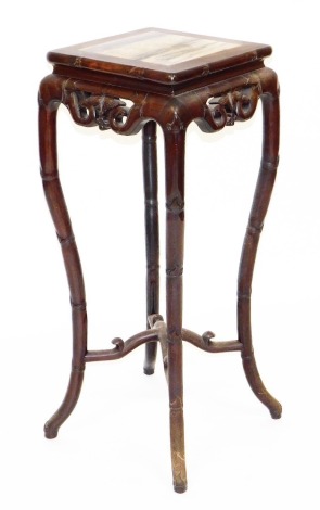 A late 19thC Chinese hardwood plant stand, the square top with marble inset, the splayed legs carved in imitation of bamboo, 92cm high, 36cm wide, 36 deep.