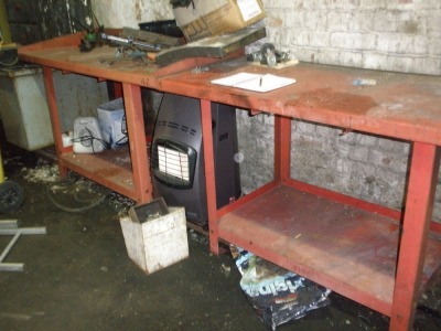 Four red steel work benches, one with a wooden base. - 2