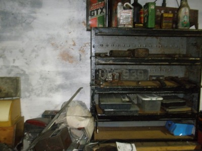 The residual contents of workshop. To include three steel work benches, two filing cabinets, vintage welder, quantity of alloy wheels, vintage tyre remover, pipe bender, carriage jack, bottle jacks, coopered barrel, AA directional marker signs, heavy dut - 5