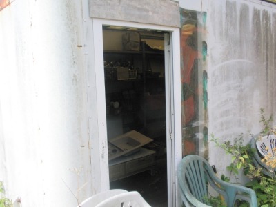 Two truck bodies for storage containers and their contents, plus the contents of the jack leg porta cabin and brick office to the entrance of the site. - 2