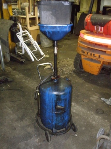 A Sealey sump oil drain trolley.